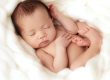 Sleeping baby nestled in soft blanket. resized for mobile