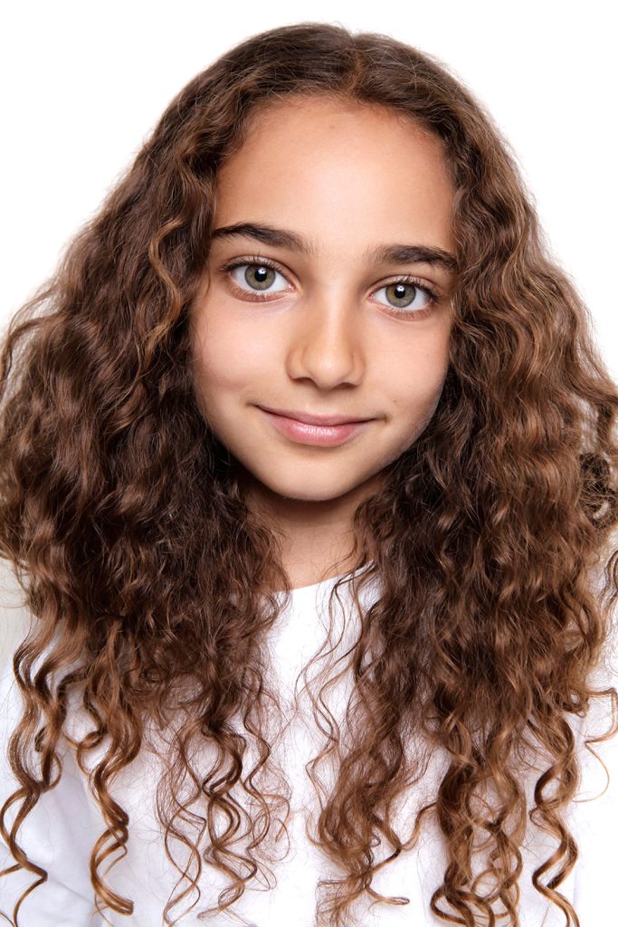 a girl headshot for modelling portfolio photography for children. child acting headshot London